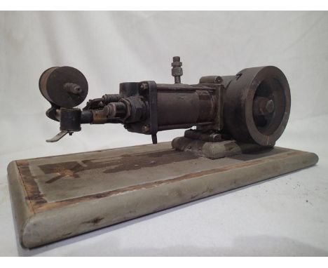 Unbranded horizontal, stationary, steam engine on a wooden plinth 30 x 12cm H. Parts appear to be moving, unable to confirm c