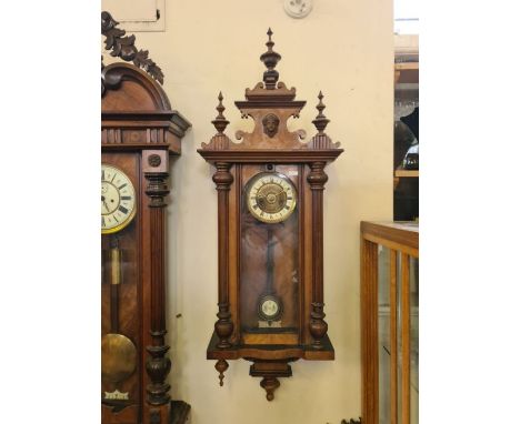 Victorian Vienna wall clock with spring wound movement in generally good condition.  Brass and enamel Roman numeral dial, mov