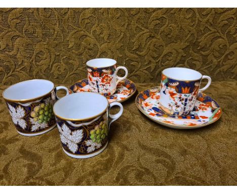 Pair of mid Victorian Copeland Imari teacups and saucers and a pair of coffee cans decorated with grapes and vines.