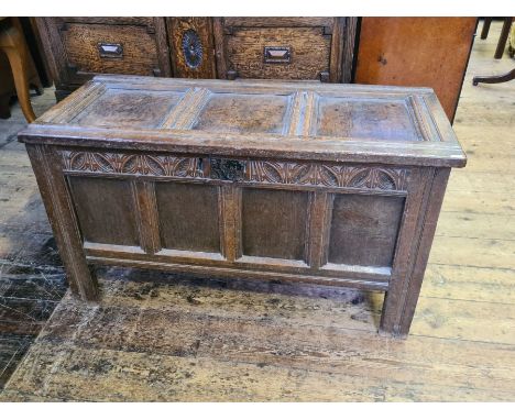 Georgian oak 3 panel coffer with carved top rail, good patina.  Wire strap hinges, internal candle box, lock missing, no spli