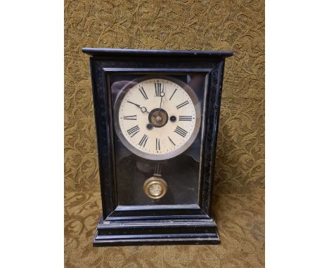 Edwardian mantle clock in lacquered wooden case with working movement standing 34cm tall.