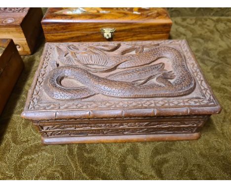 Indian carved trinket boxes and a decorative glove box.