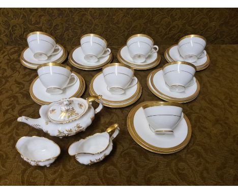 8 Royal Doulton Royal Gold trios and a Hammersley Elegance pattern gilt small teaset.