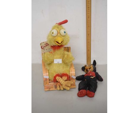 A vintage Chokers Anger Management chicken toy together with a vintage Mickey Mouse toy