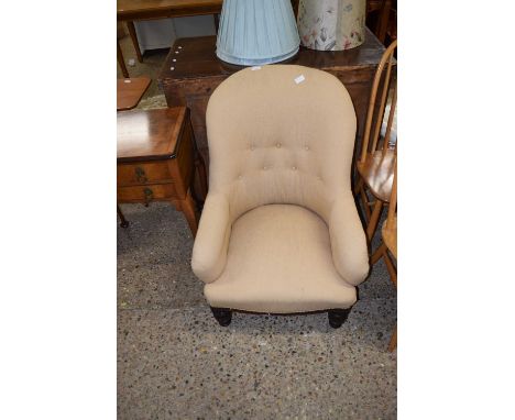 A Victorian button back armchair