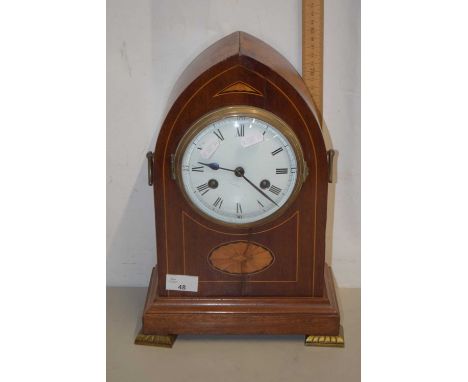 An Edwardian lancet cased mantel clock with brass movement striking on a coil