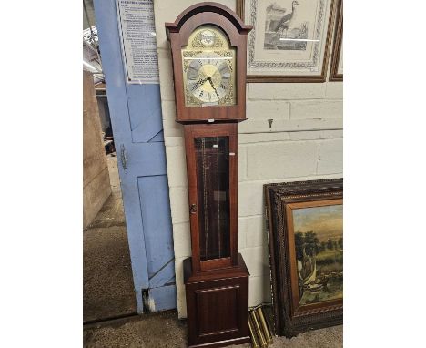 A modern grandmother clock with triple weight movement