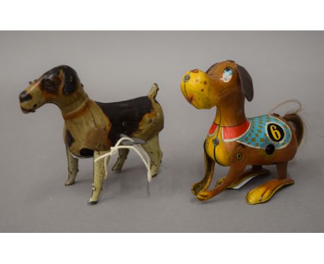 Two vintage tinplate clockwork dogs, one DRGM and the other Made in China. The former 13 cm long.