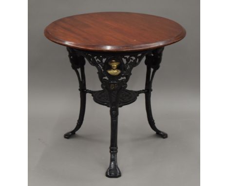 A Baden Powell cast iron pub table. 75 cm diameter.