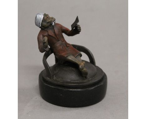 A bronze model of a smoking monkey. 6.5 cm high.
