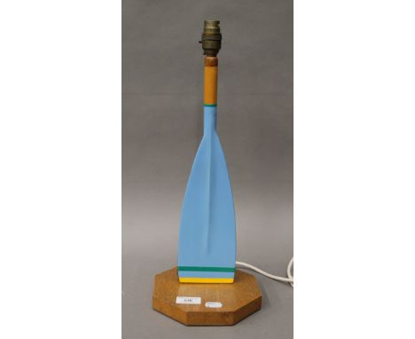 A painted wooden oar form table lamp. 44 cm high.