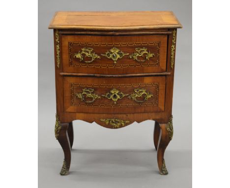 A 19th century Continental gilt brass mounted bombe shape commode. 63 cm wide.