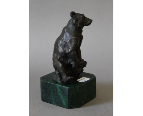 A bronze model of a bear on a marble base. 15 cm high.