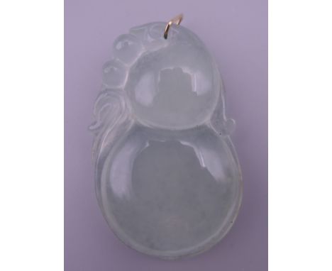 A gold mounted icy jade pendant.  5.5 cm high.