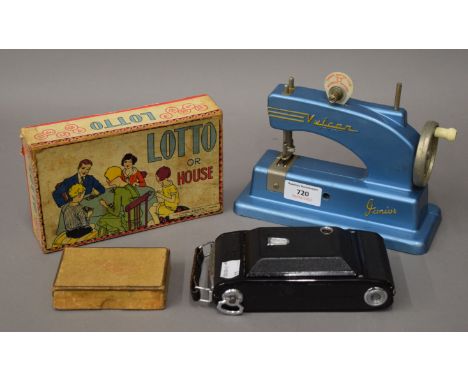 A vintage child's Vulcan sewing machine, a Lotto game and a camera, etc.