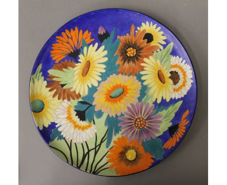 A Carltonware charger decorated with flowers. 32 cm diameter.
