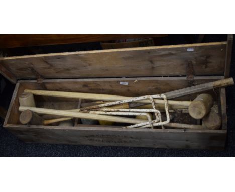 A vintage boxed croquet set. 