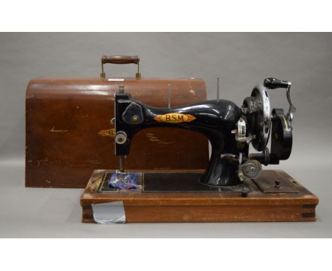 A boxed vintage sewing machine.