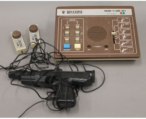 A vintage Binatone games console with gun.