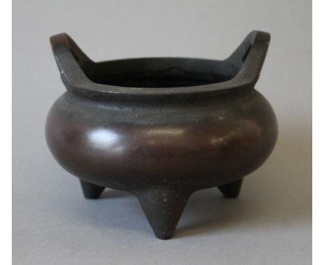 A Chinese bronze censer. 17 cm wide.
