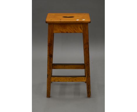 A vintage laboratory stool. 67 cm high.