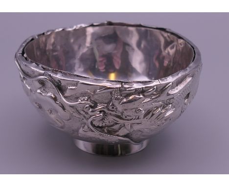 A small Chinese silver bowl.  4.5 cm high. 84.9 grammes.