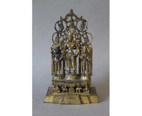 An Eastern gilt bronze shrine. 28 cm high.