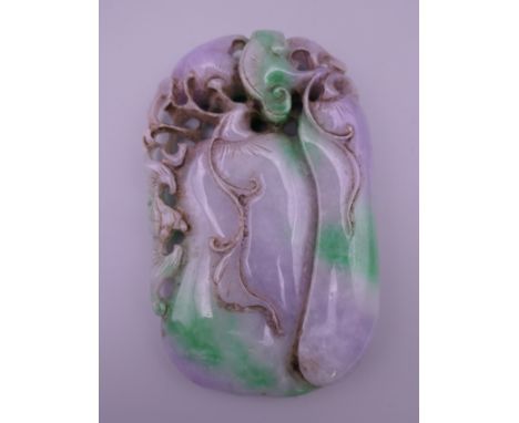 A large two tone jade pendant.  10 x 6 cm.