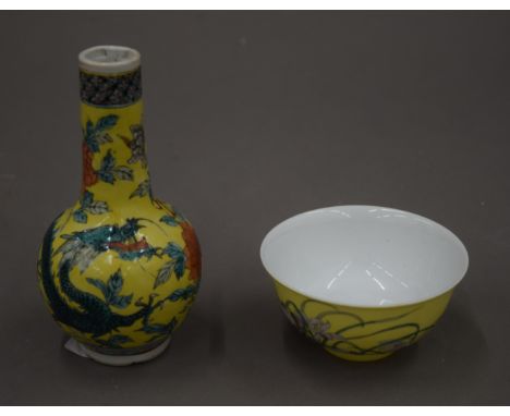 A 19th century Chinese porcelain yellow ground bottle vase, six character Kangxi mark to base and a Chinese porcelain hand pa