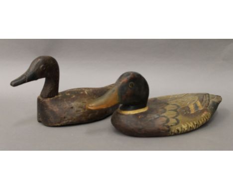 Two vintage wooden decoy ducks. The largest 36 cm long.