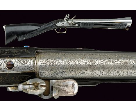 A flintlock blunderbuss dating: late 19th Centuryprovenance: BelgiumSlightly bell-mouthed barrel featuring remains of floral 