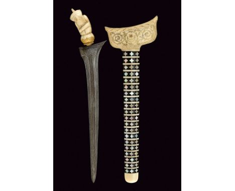 A fine kris dating: 20th Centuryprovenance: IndonesiaStraight, double-edged blade of fine parmor; metallic mendak and selut, 