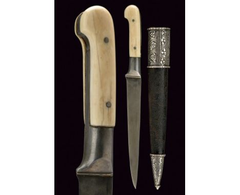 A kard dating: 19th Centuryprovenance: AfghanistanStraight, single-edged blade of fine damask, grooved at the back; iron hilt