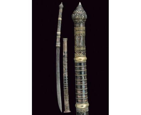 A silver mounted dha dating: 19th Centuryprovenance: BurmaSlightly curved, single-edged blade; long wooden grip completely si