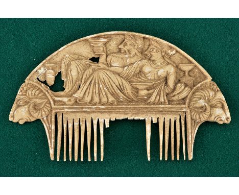 A comb dating: 800 - 400 B. C.provenance: Eastern EuropeMade of bone. Round upper part with the effigy of a couple (royal?) l