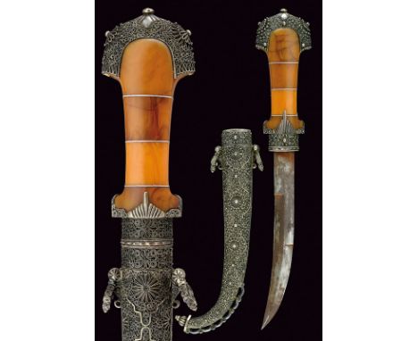 A beautiful silver mounted koummya dating: circa 1900provenance: MoroccoStrong, curved, single -and false-edged blade with ar