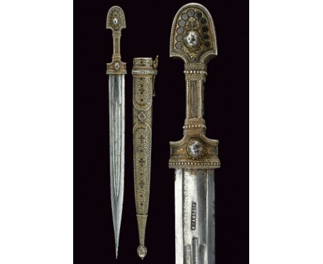 A kindjal dating: late 19th Centuryprovenance: CaucasiaStraight, double-edged blade with triple fuller, engraved with spirals