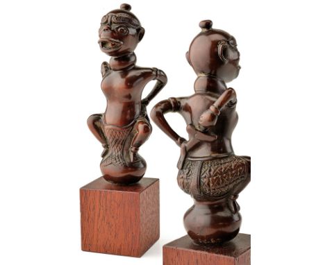 A rare grip for a kris dating: 19th Centuryprovenance: BaliWooden grip shaped as a human figure with his hands behind the bac
