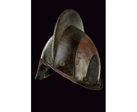 A black and white morion dating: circa 1600provenance: Southern GermanyIron skull, in two halves joined at the comb which is 