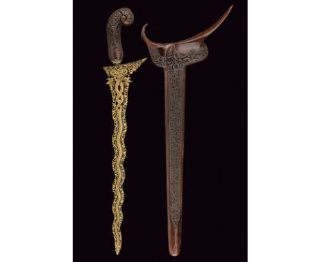 A kris with pierced and gilt blade dating: 19th Centuryprovenance: MalaysiaUndulated blade, with no edge, of lenticular secti