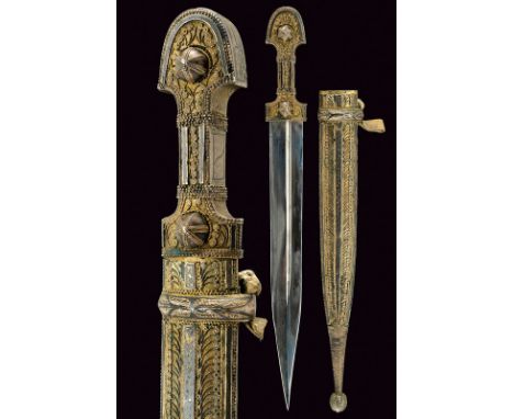 A kindjal dating: late 19th Centuryprovenance: CaucasiaStraight, double-edged blade with deep and asymmetrical groove; gilt s