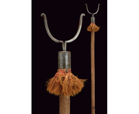 A gun-fork dating: circa 1700provenance: EuropeIron fork on a cylindrical, wooden haft covered with fabric (probably velvet, 