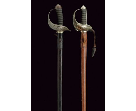 A lot of two swords dating: circa 1900provenance: EnglandStraight blade with proof-mark, engravings and mark of the manufactu