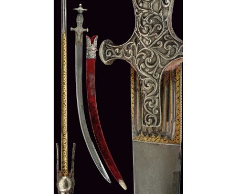 A tulvar dating: 19th Centuryprovenance: IndiaHeavy, curved, single -and false-edged, damask blade with multiple grooves, tan