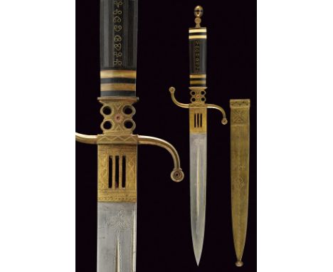 A fine knife dating: circa 1900provenance: North AfricaStraight, single-edged blade with thin grooves and engravings, brass-p