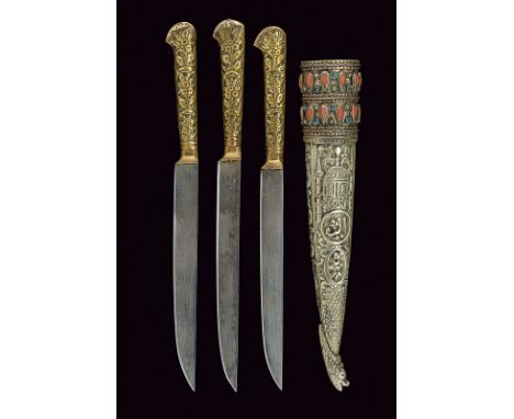 A trousse with three knives dating: 19th Centuryprovenance: TurkeyThree knives with straight, single-edged blade, brass-plate