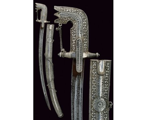 A silver mounted saif dating: 19th Centuryprovenance: ArabiaInteresting curved, single -and false-edged blade, probably Ethio