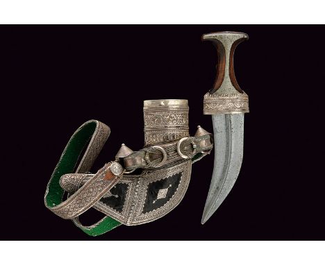 A jambyia with scabbard and belt dating: circa 1900provenance: YemenCurved, double-edged blade with strong, central raiser; t