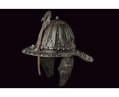 An officers lobster-tailed helmet dating: late 19th Centuryprovenance: Northern GermanyHemispherical, iron skull with embosse