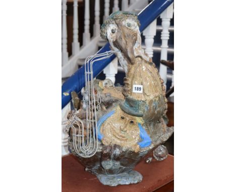 A Studio pottery model of a saxophone-playing pelican